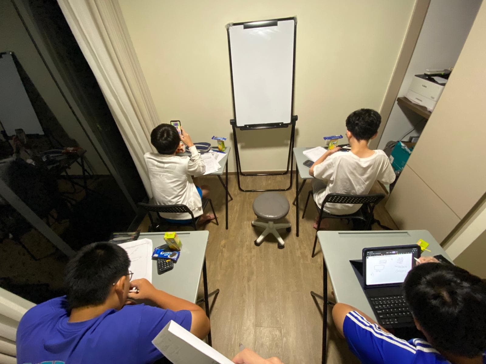 Students working on practice papers at JLearning